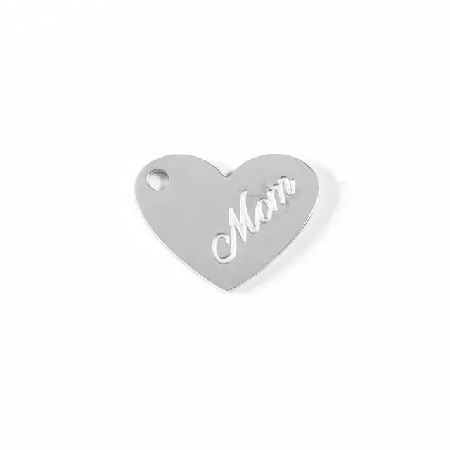 Stainless steel mom heart charm by Winks Design Studio, LLC, featuring a polished, detailed heart-shaped pendant for jewelry-making.
