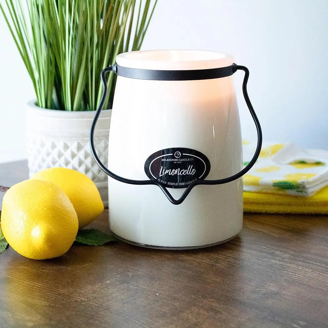 Winks Design Studio Milkhouse Candle Co. 22 oz Butter Jar Candle in Limoncello with bright yellow wax and lemon-themed label