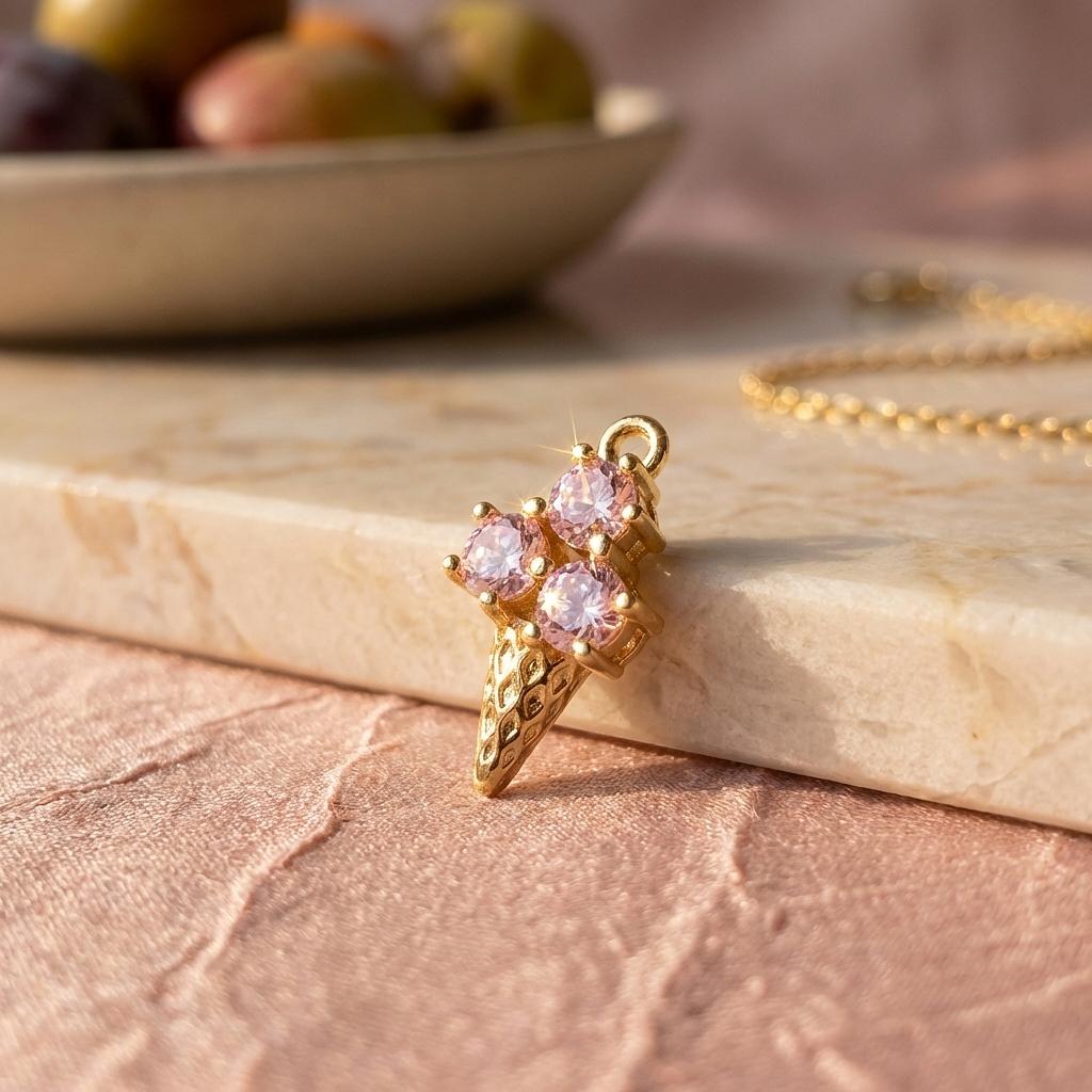 Gold enamel strawberry ice cream cone charm from Winks Design Studio, LLC, perfect for summer jewelry and charm accessories.