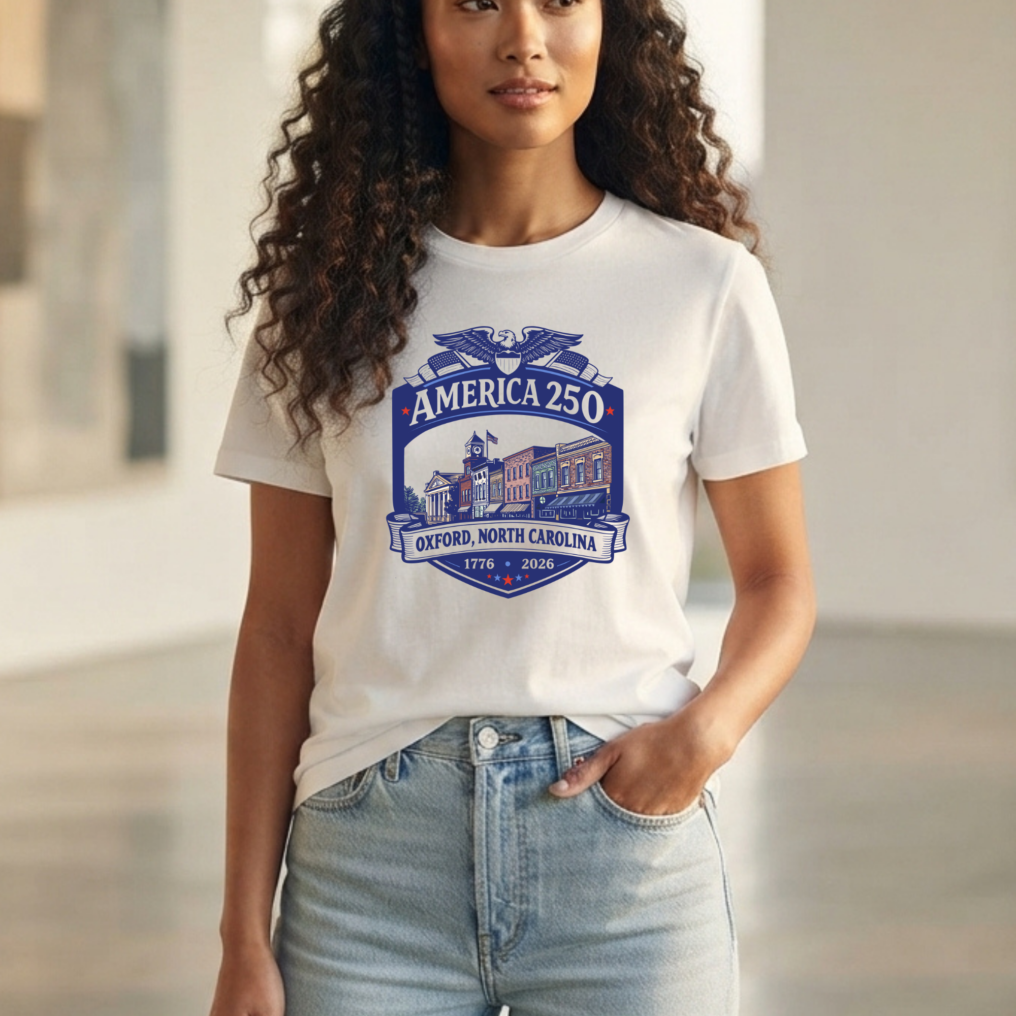 A woman wearing a white graphic t-shirt with a blue and purple &