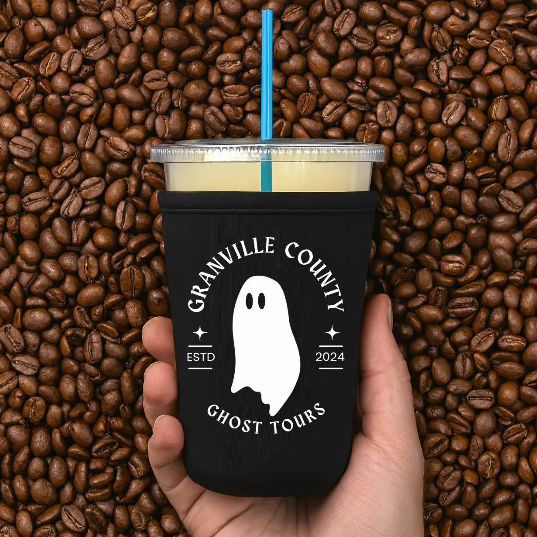 Winks Design Studio LLC Granville County Ghost Tours cup sleeve with spooky ghost design on black background
