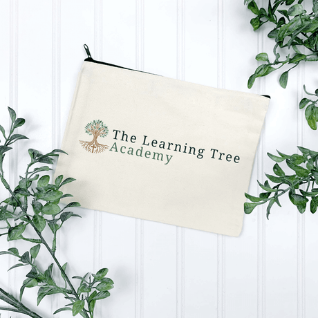 Stylish canvas pencil bag featuring The Learning Tree Academy logo, perfect for students and professionals.