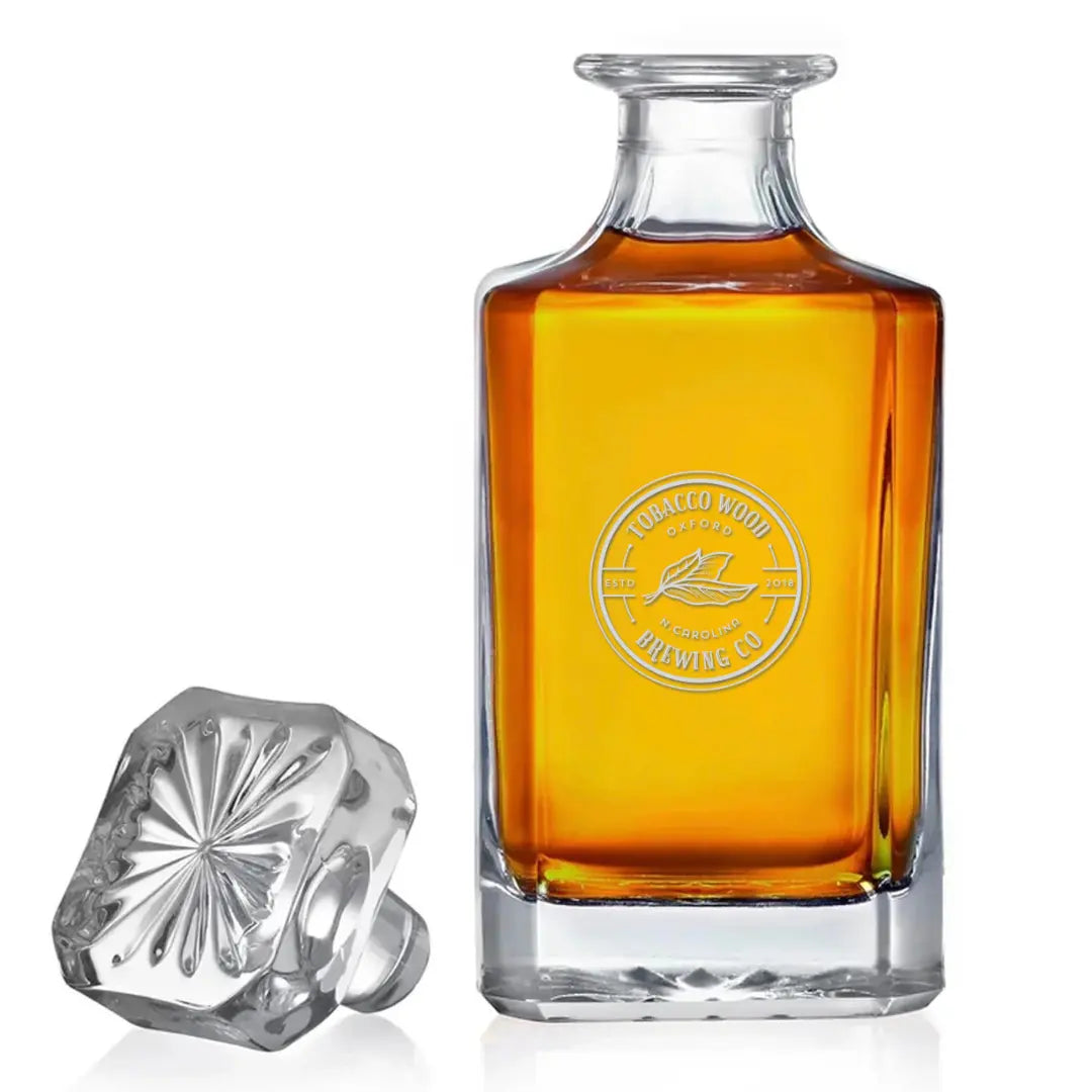 Tobacco wood engraved glass decanter with intricate design, crafted by Winks Design Studio, LLC for elegant beverage storage.