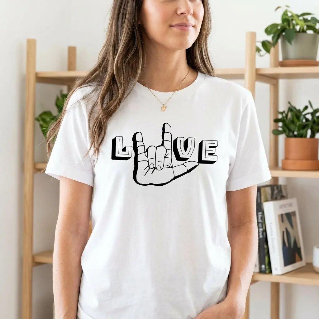 Winks Design Studio LLC ASL I Love You T-shirt featuring a bold hand gesture graphic on a casual white shirt.