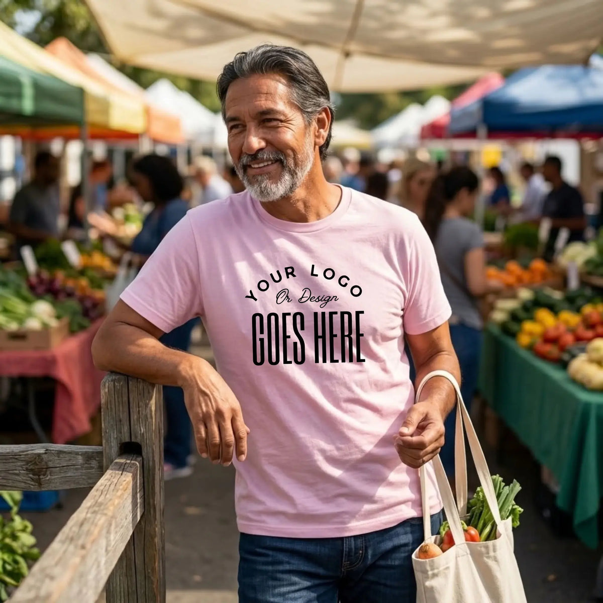 Light pink custom t-shirt with a large black "Your Logo or Design Goes Here" center chest placeholder print