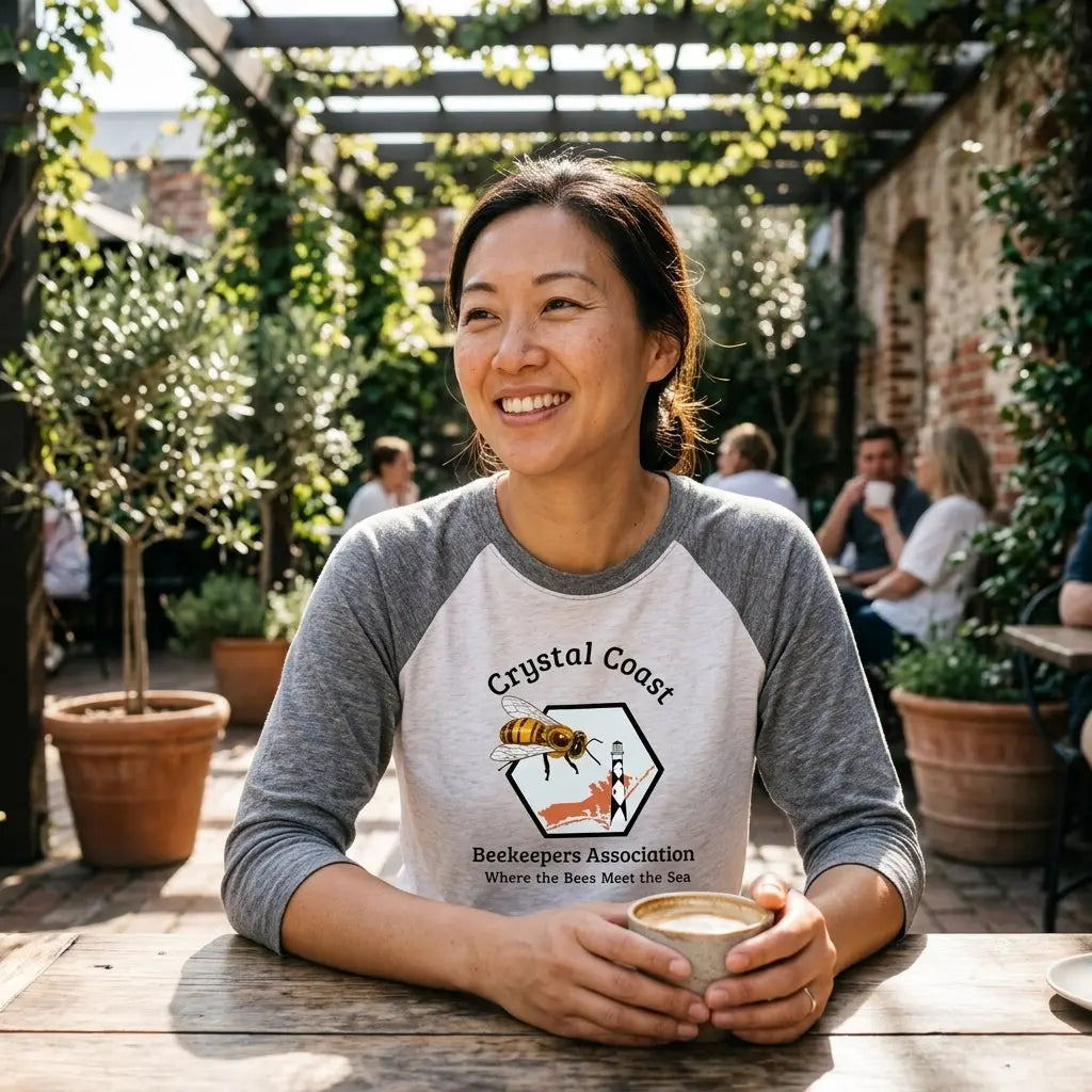 Winks Design Studio Crystal Coast beekeepers raglan shirt featuring a navy and white bee and honeycomb pattern on soft fabric