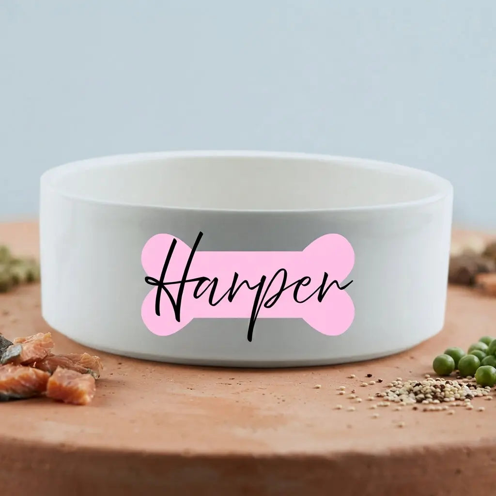 Custom bone-shaped ceramic dog bowl by Winks Design Studio, LLC, featuring a durable and stylish design for pets.