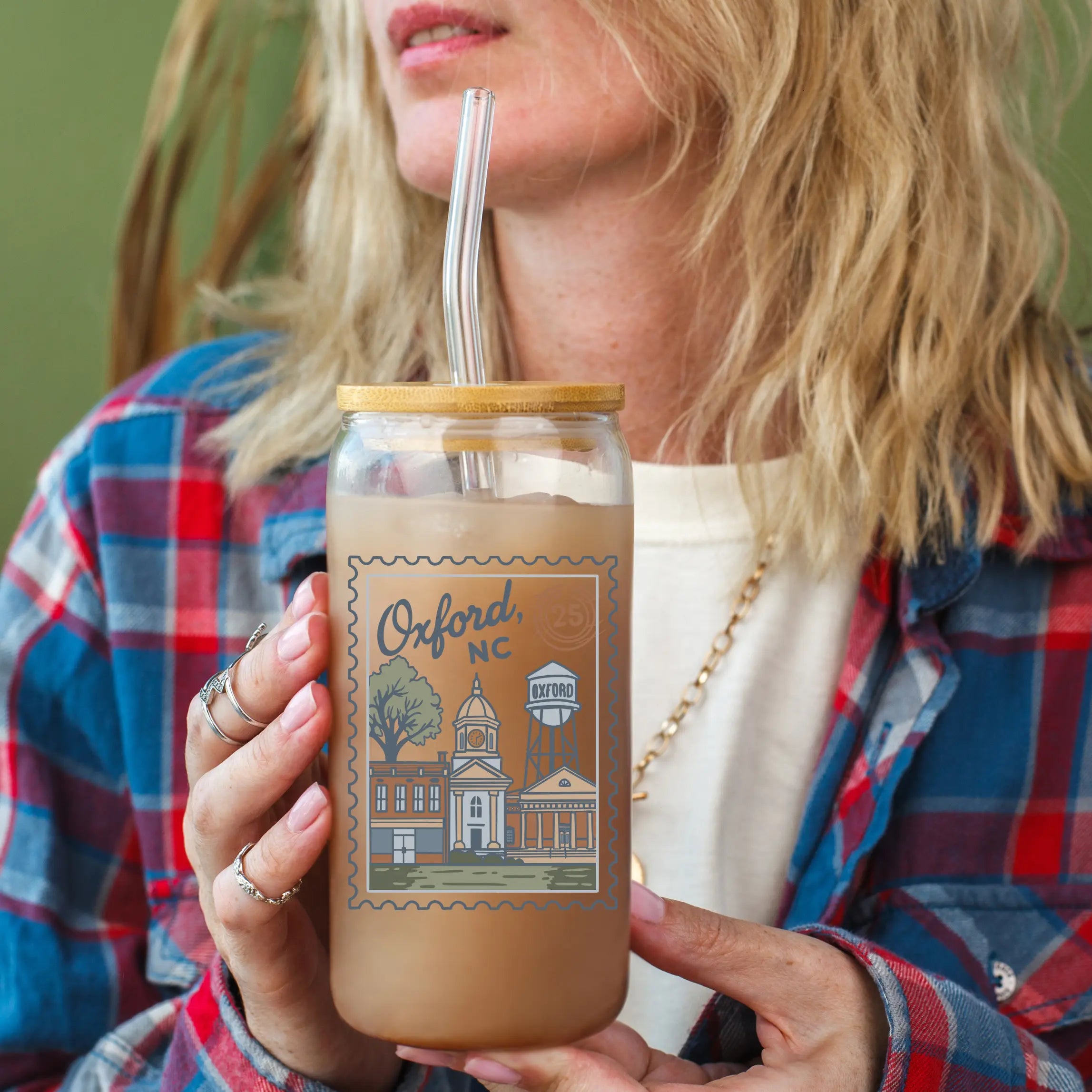 Clear glass beer mug with "Oxford NC" and postage stamp design, 20oz capacity, by Winks Design Studio LLC.