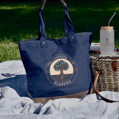 Elegant navy tote bag featuring The Learning Tree Academy logo, perfect for beach trips and daily errands.