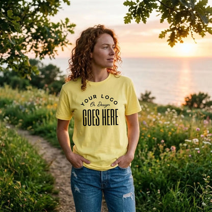 Pale yellow custom t-shirt with a large black "Your Logo or Design Goes Here" center chest placeholder print