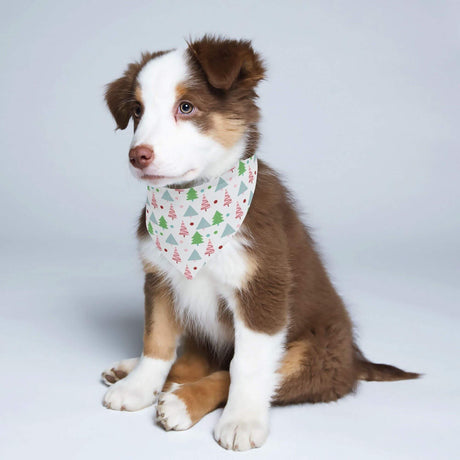 Adorable puppy wearing a Christmas Tree Dog Bandana with festive tree pattern, perfect for holiday celebrations.