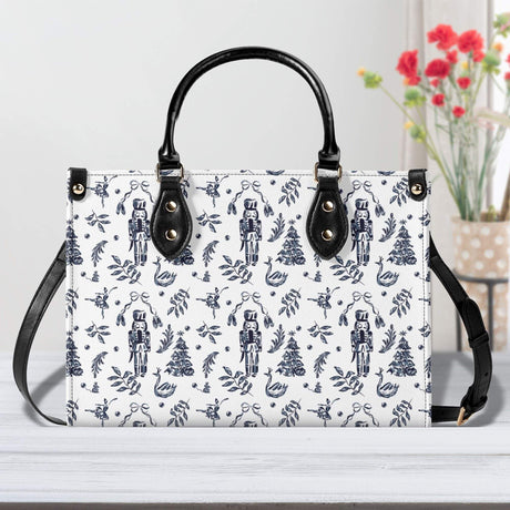 Nutcracker Luxury Leather Handbag with elegant floral and nutcracker print on a white background. Perfect for stylish everyday use.