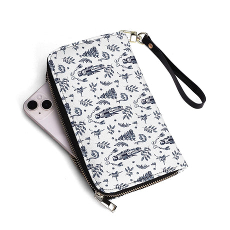 Nutcracker leather wallet in white design with floral patterns, alongside a smartphone, showcasing style and versatility.