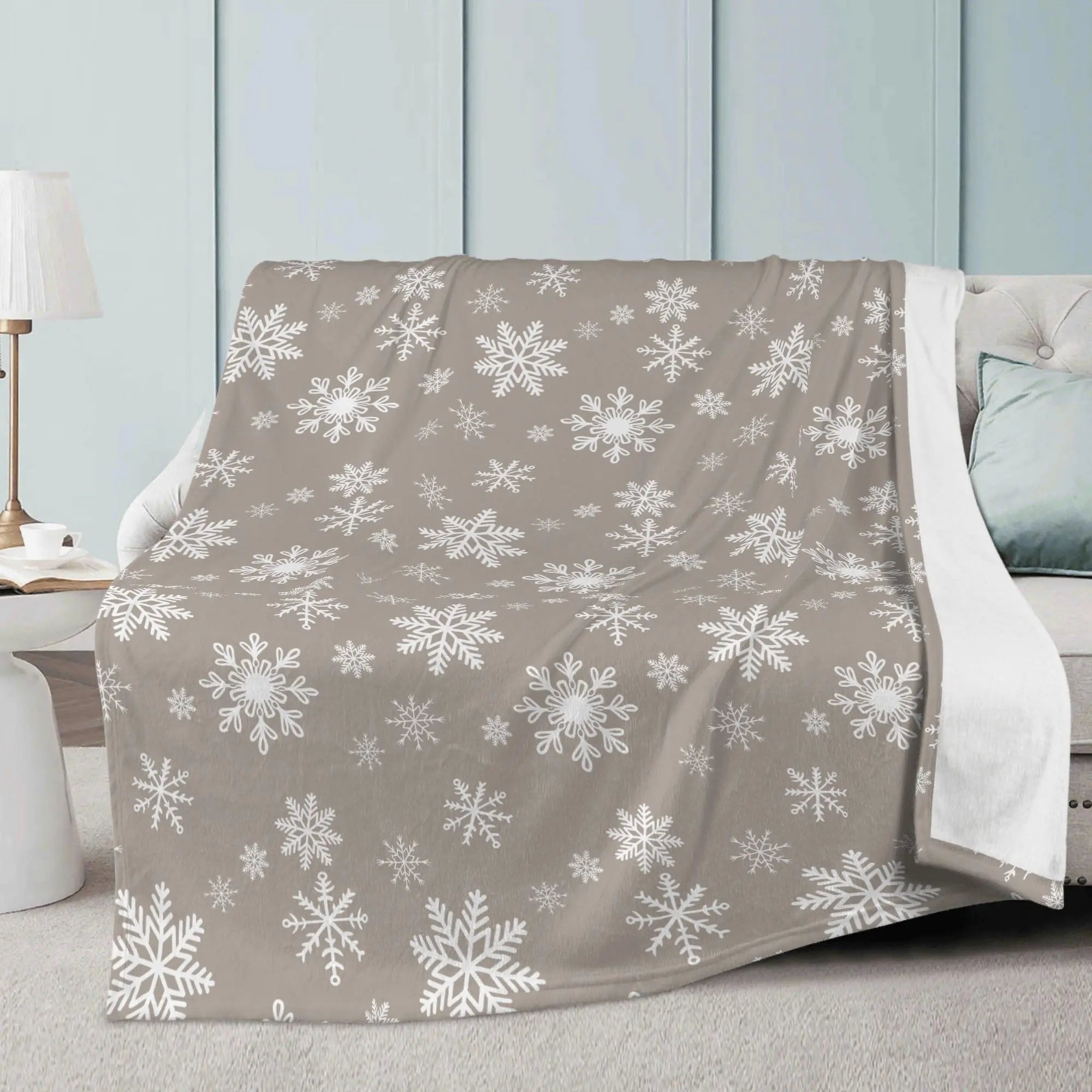 Winks Design Studio LLC snowflake-themed fleece blanket 80x60 in cozy holiday throw style, featuring a festive snowflake pattern.