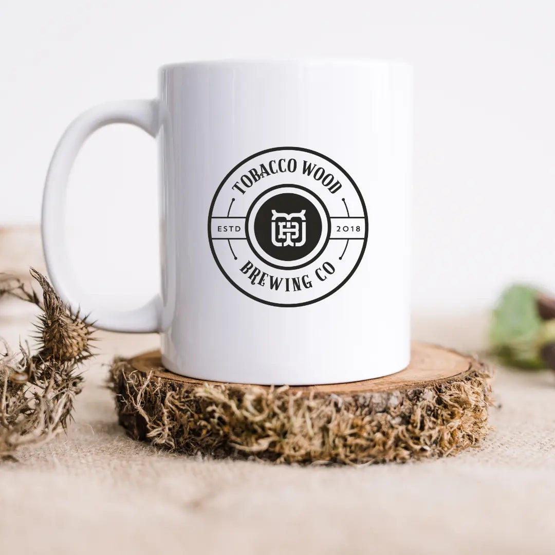 Tobacco Wood Brewing ceramic mug by Winks Design Studio, LLC featuring a rustic wood design and sturdy handle.