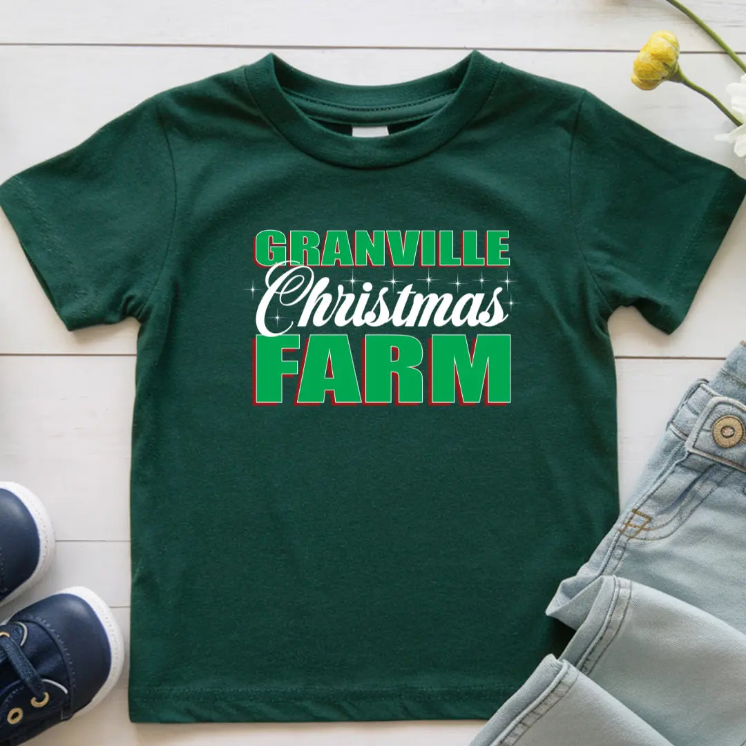 Kids wearing Granville Christmas Farm T-shirt by Winks Design Studio, LLC, featuring festive holiday farm scene and Christmas-themed graphics.