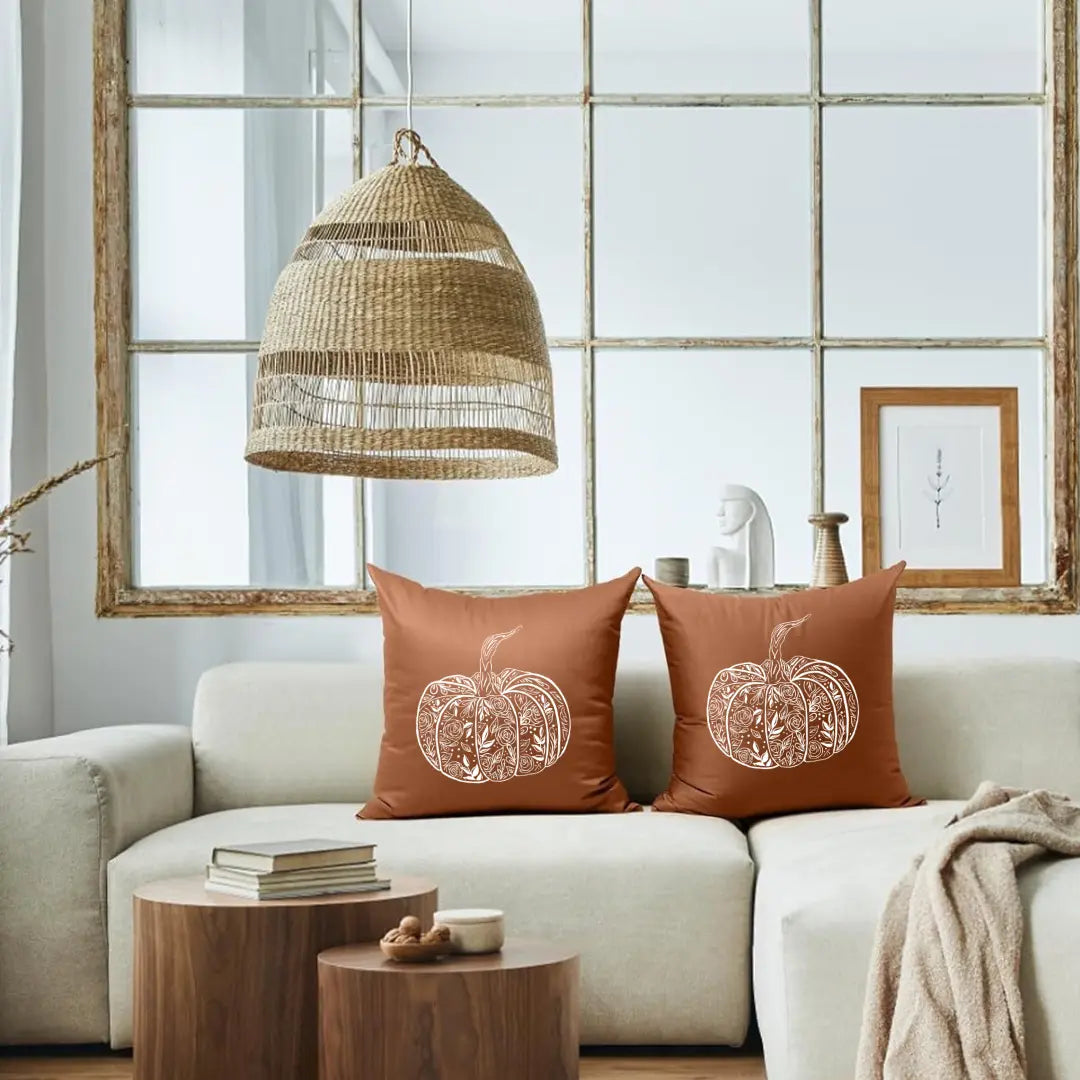 Flower pumpkin pillow by Winks Design Studio, LLC featuring a cozy, decorative pillow with floral and pumpkin design.