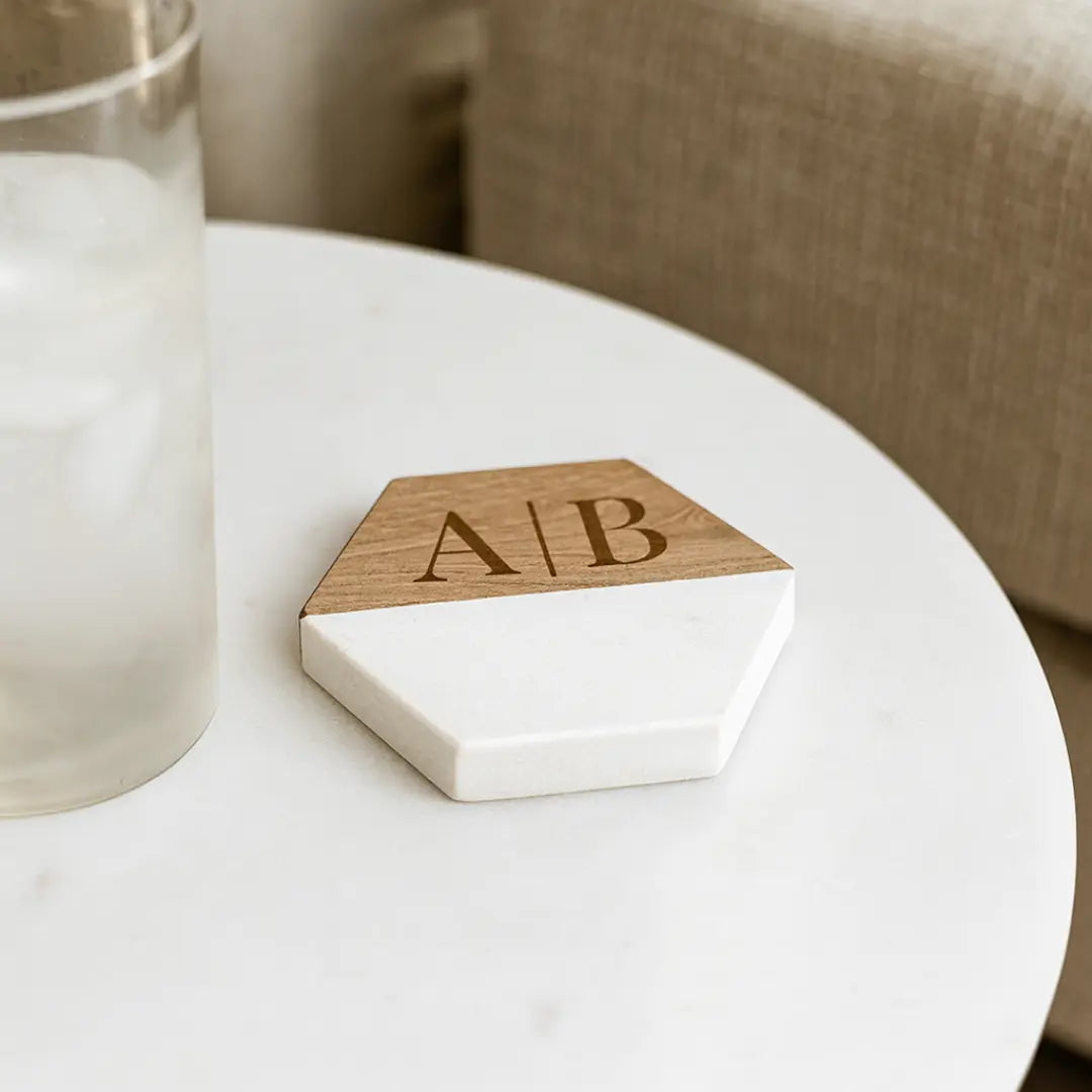 Custom engraved marble coaster set from Winks Design Studio, LLC featuring elegant round coasters with personalized engraving.