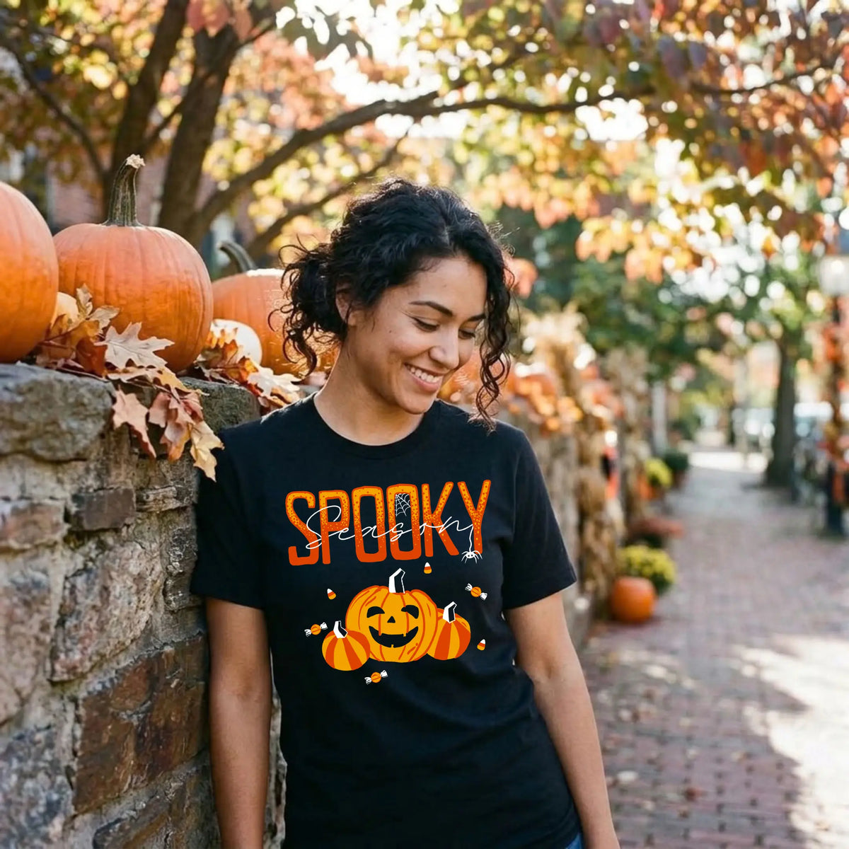Black "Spooky Season" Halloween graphic tee with a smiling jack-o&