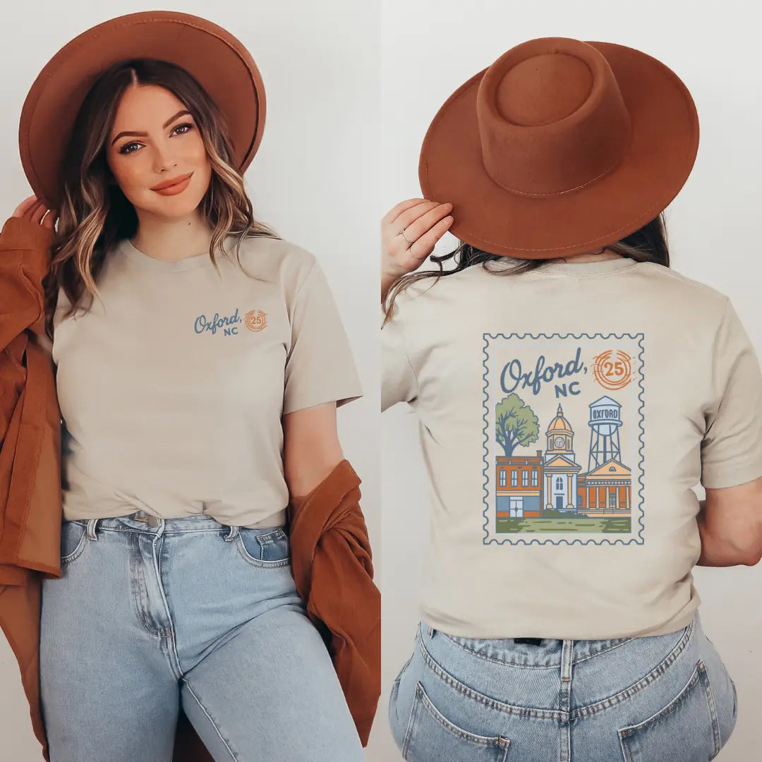 Winks Design Studio Oxford NC Postmark T-shirt featuring a casual fit with printed postal design on soft fabric.