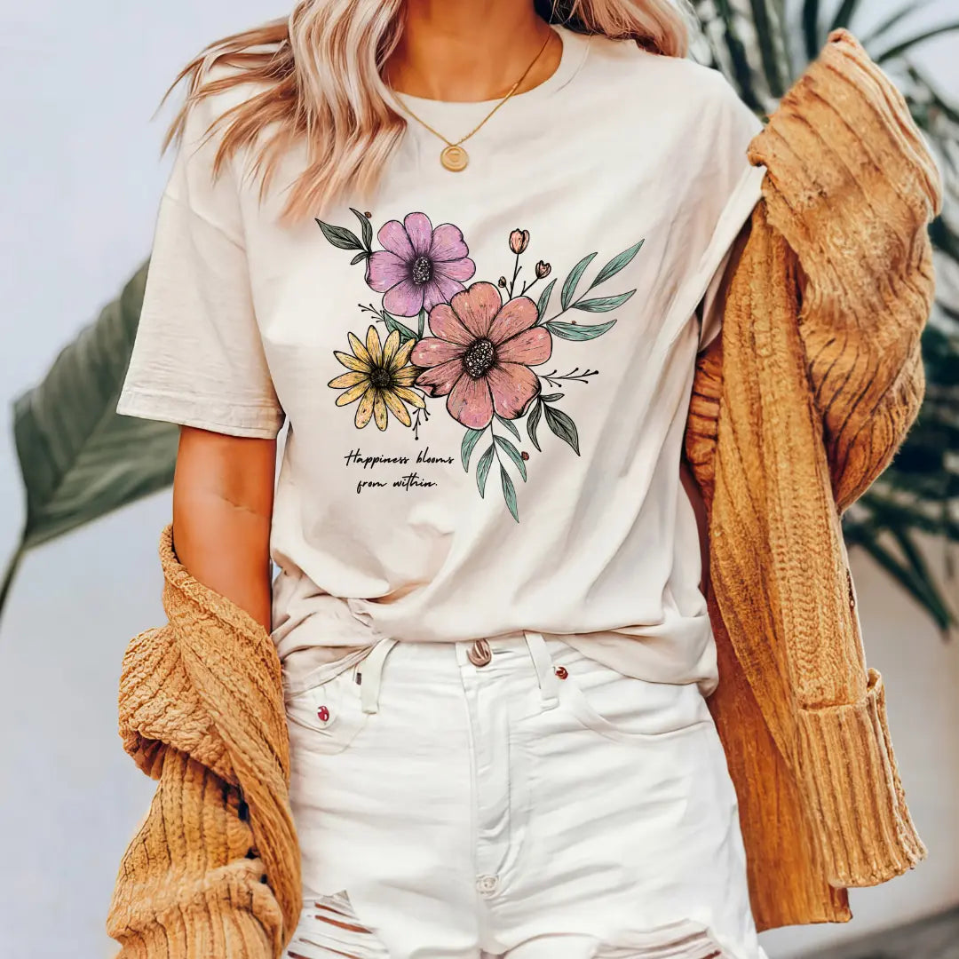 Winks Design Studio happiness blooms from within T-shirt with colorful floral design on white fabric, casual and stylish clothing.