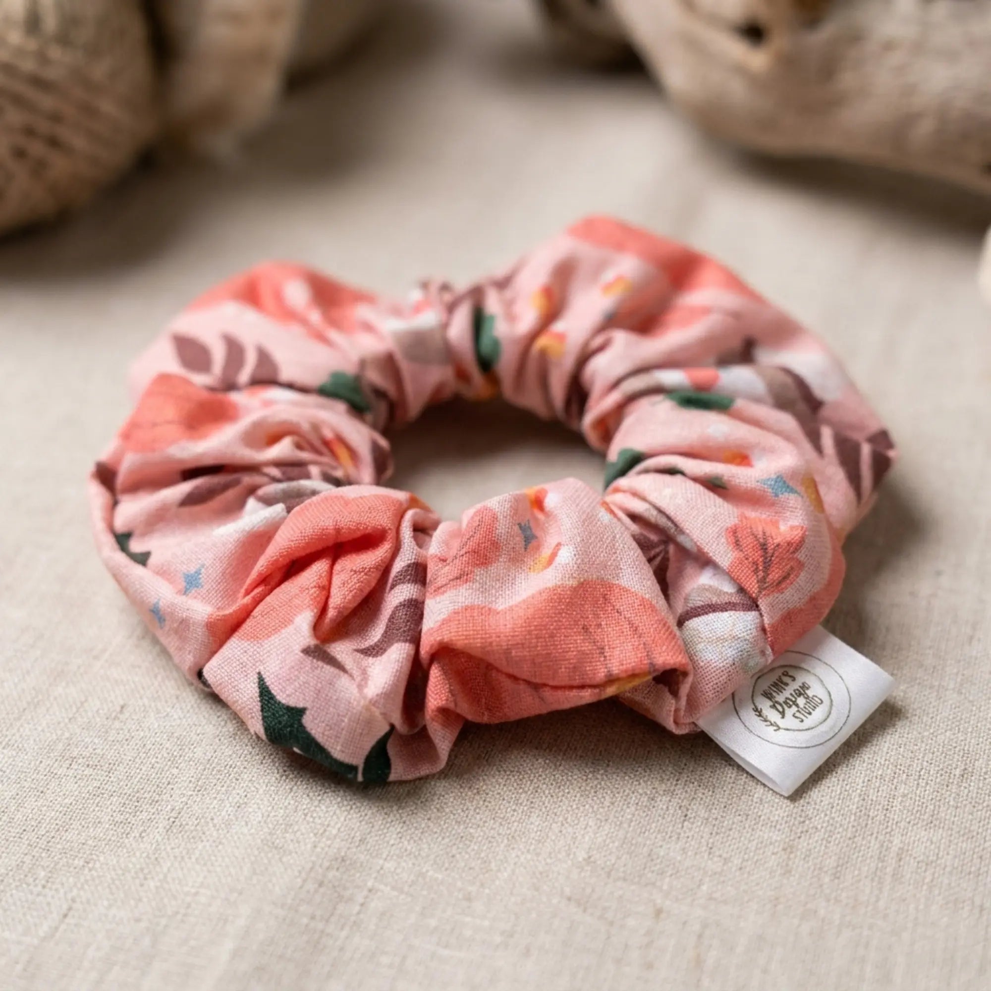 Winks Design Studio fall-themed pumpkin patch scrunchie with orange and brown fabric, cozy hair accessory for autumn.