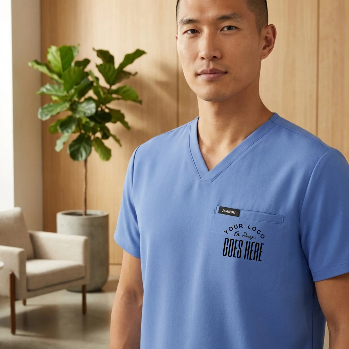 Custom Jaanuu 3-pocket V-neck scrub top by Winks Design Studio, LLC, featuring a professional medical uniform shirt with practical pockets.