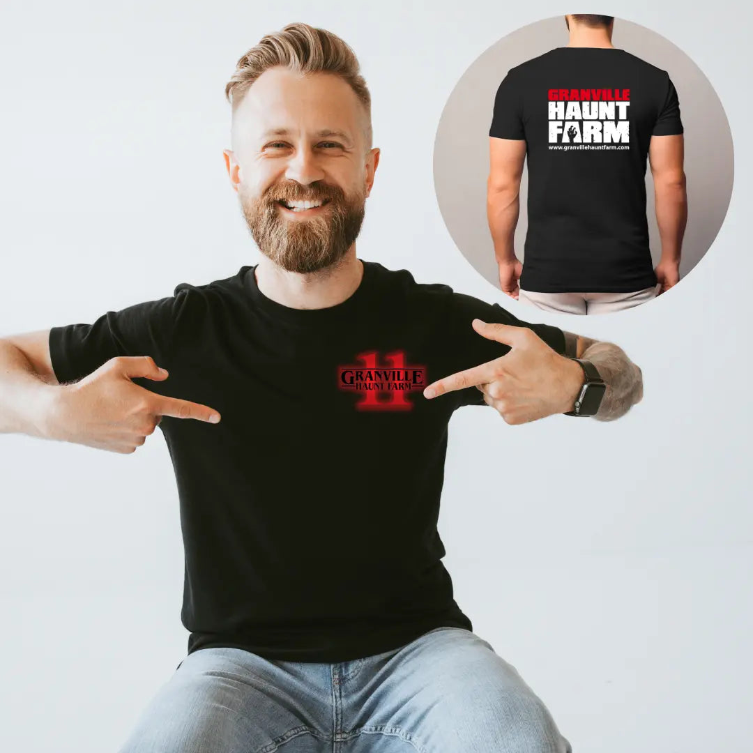 Winks Design Studio LLC Granville Haunt Farm Eleven T-shirt featuring a spooky farm logo and Halloween-themed design on a black cotton T-shirt.
