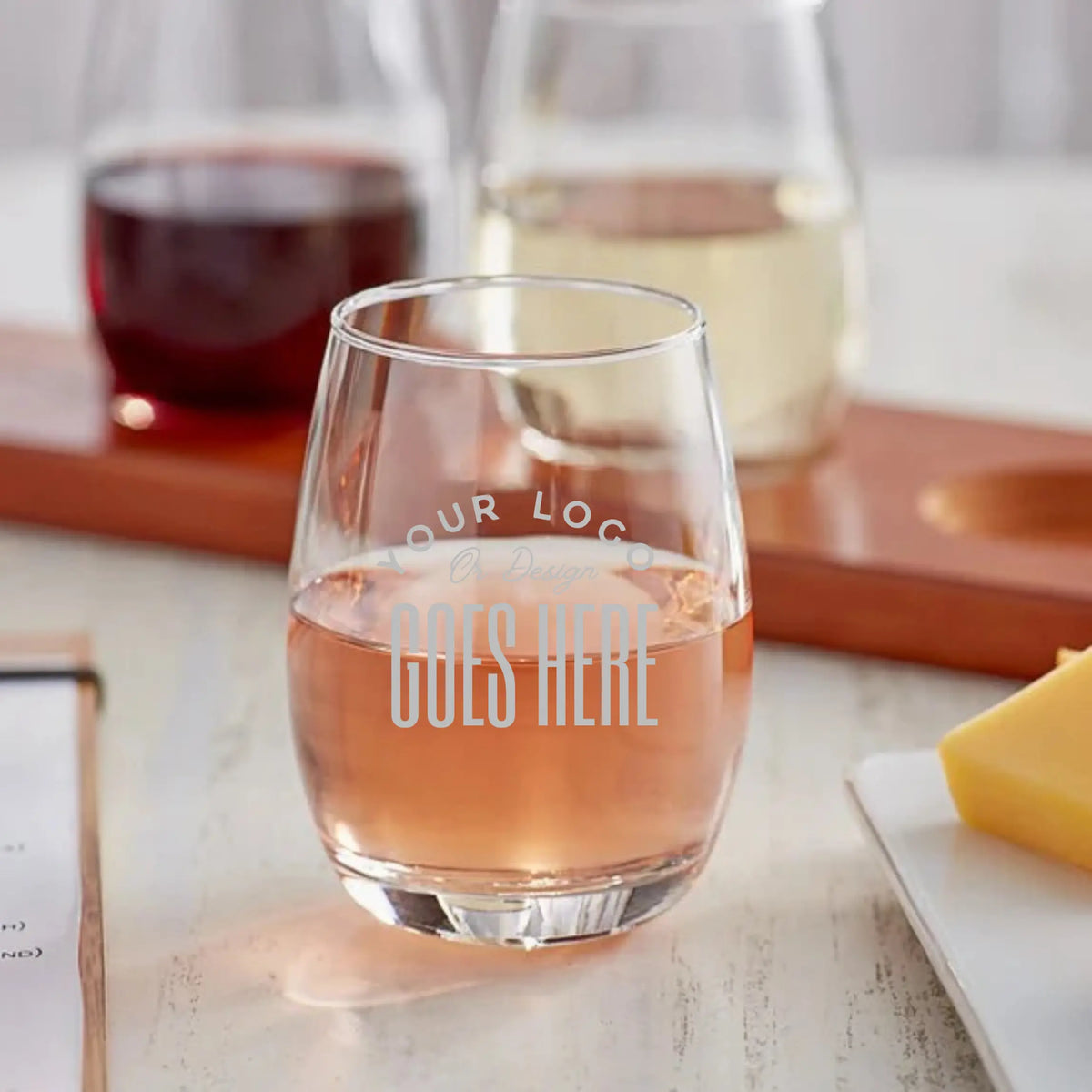 Custom engraved 6oz stemless wine glass from Winks Design Studio, LLC with intricate design and clear glass body.