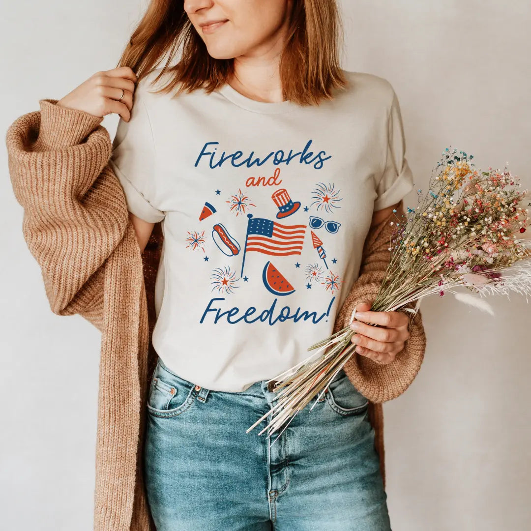 Fireworks and Freedom T-shirt by Winks Design Studio, LLC featuring a colorful fireworks graphic on a casual t-shirt.