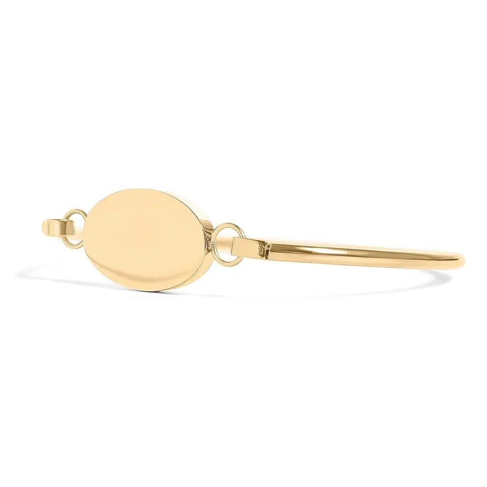 Engravable oval 18K gold bracelet by Winks Design Studio, LLC featuring personalized engraving and elegant design.