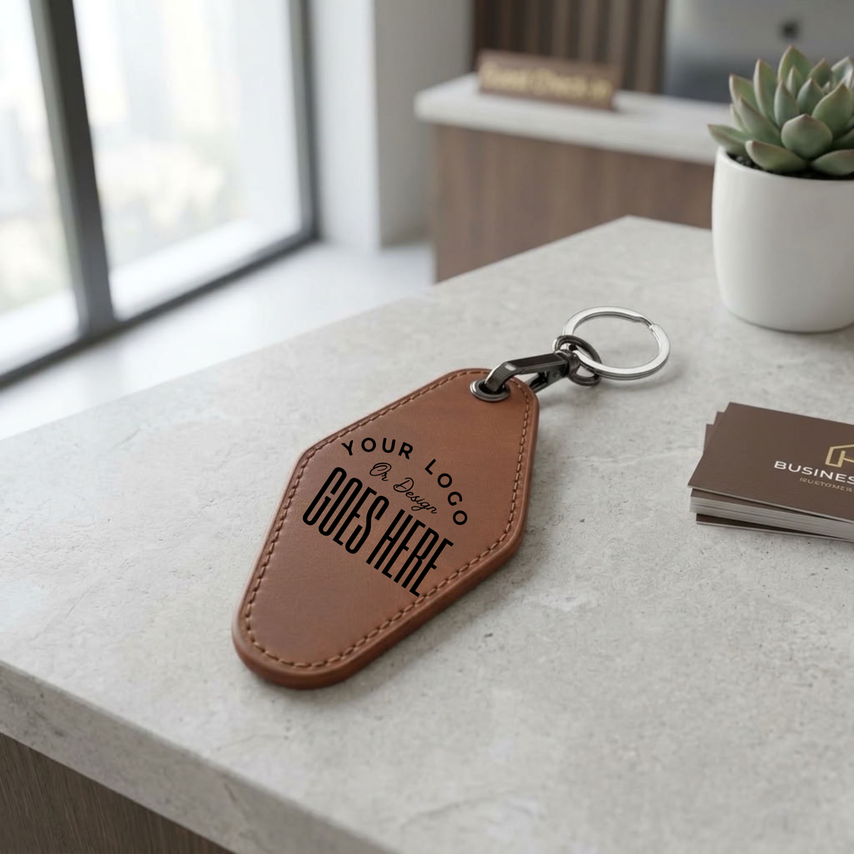 A brown leather keychain with a custom printed placeholder logo and the text &