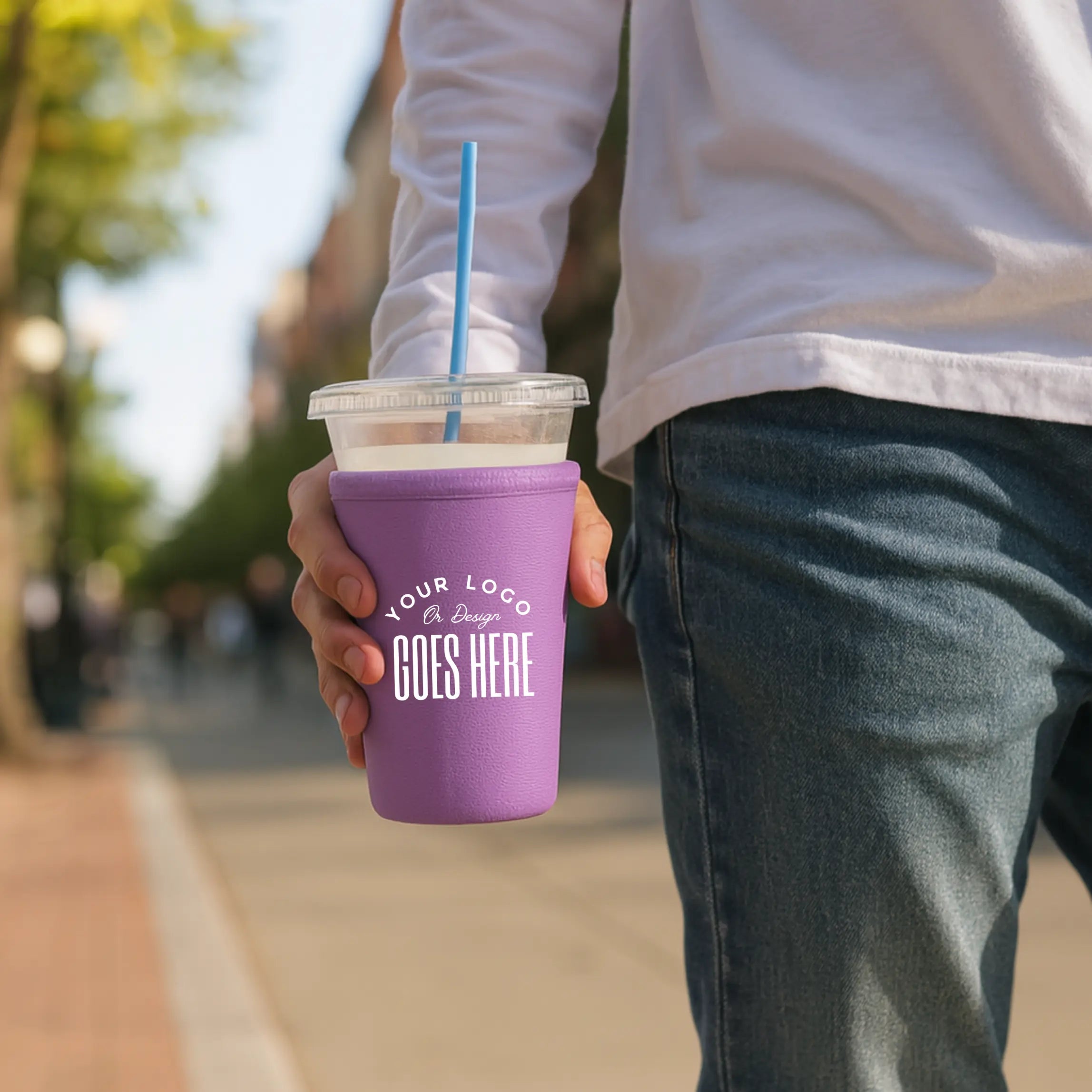 Custom neoprene cup sleeve with Winks Design Studio branding, featuring a snug fit and vibrant design on a coffee cup.