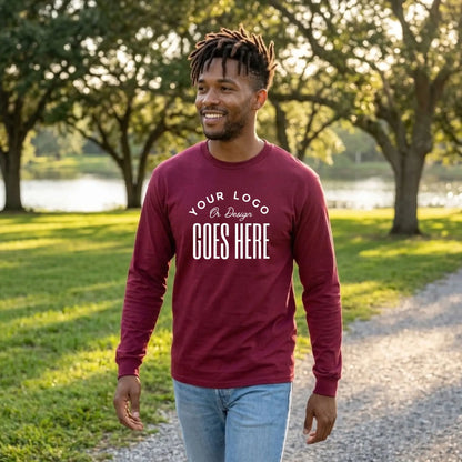 Maroon custom long sleeve t-shirt with a large white "Your Logo or Design Goes Here" center chest placeholder print