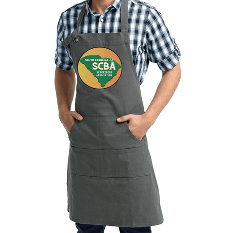 SCBA Pocketed Apron in durable cotton-polyester blend, worn by a person, featuring multiple spacious pockets for tools and essentials.