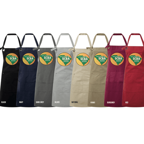 SCBA pocketed apron in various colors including black, navy, dark grey, silver, natural, khaki, burgundy, and red displayed side by side