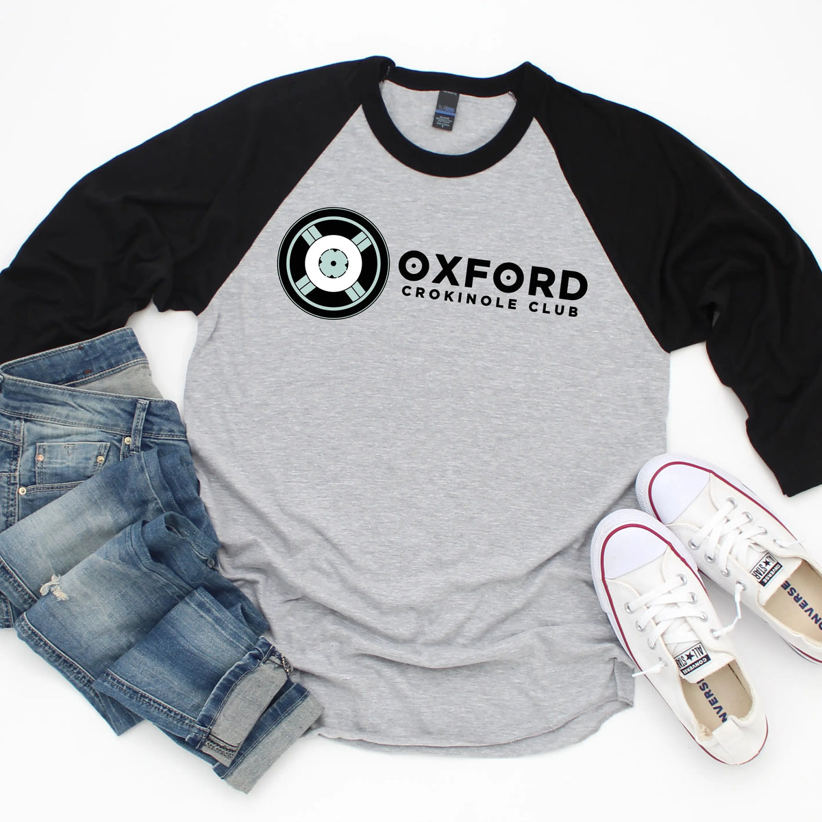 Oxford Crokinole Club raglan T-shirt by Winks Design Studio, LLC, featuring a casual cotton shirt with a printed crokinole club graphic.