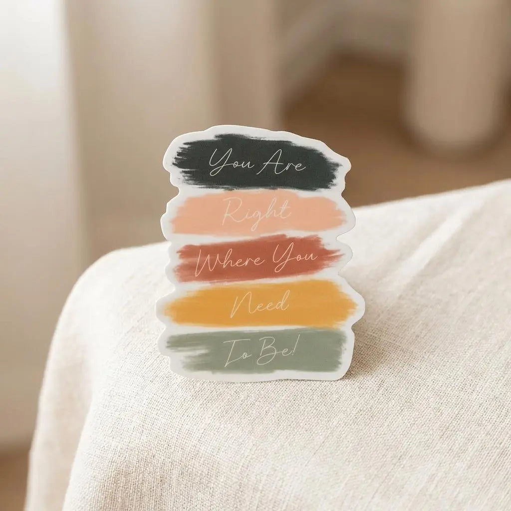 Winks Design Studio LLC sticker with inspirational message "You Are Right Where You Need To Be" on a clear background.