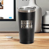 Granville Haunt Farm 20oz tumbler with logo on desk, perfect for keeping drinks at ideal temperature.