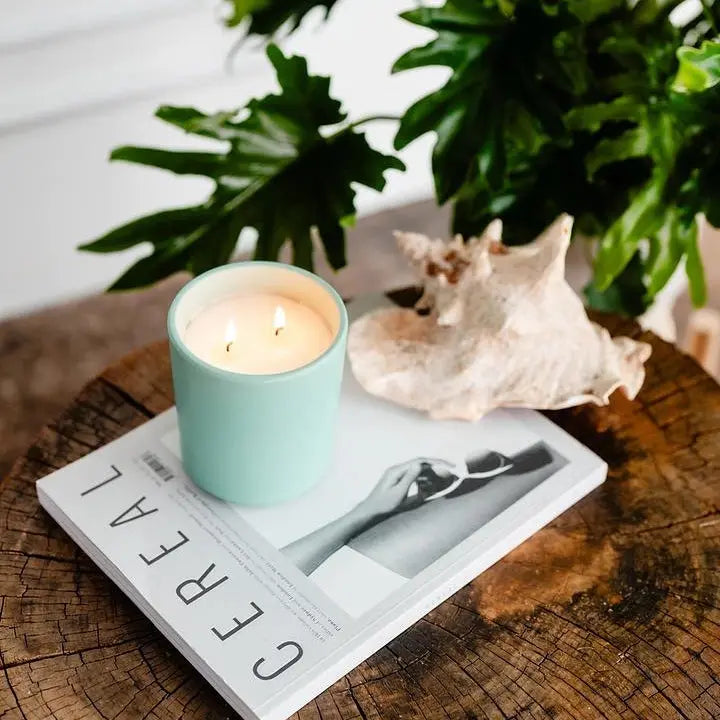 Earth &amp; Ember 13 oz candle by Winks Design Studio with a serene ocean-inspired design and natural wax finish.