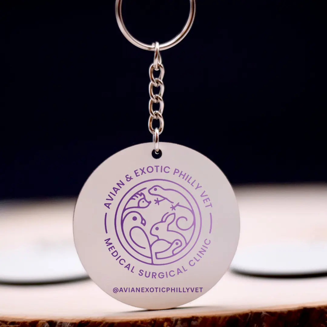 Colorful Avian Exotic keychain by Winks Design Studio, LLC featuring a detailed bird design on a metal keyring.
