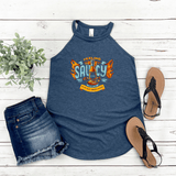 "Feeling Saucy" halter tank top for NC Hot Sauce Contest & Festival, paired with denim shorts and sandals on a wooden background