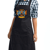 Person wearing NC Hot Sauce Contest & Festival Apron with "Feeling Saucy" design