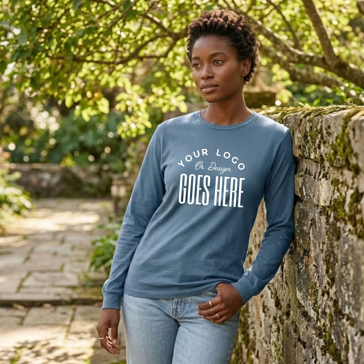 Slate blue custom long sleeve t-shirt with a large white "Your Logo or Design Goes Here" center chest placeholder print