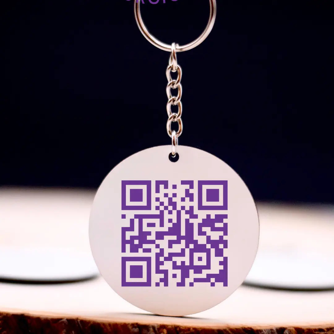 Colorful Avian Exotic keychain from Winks Design Studio, LLC featuring a detailed bird design on a small metal keychain.