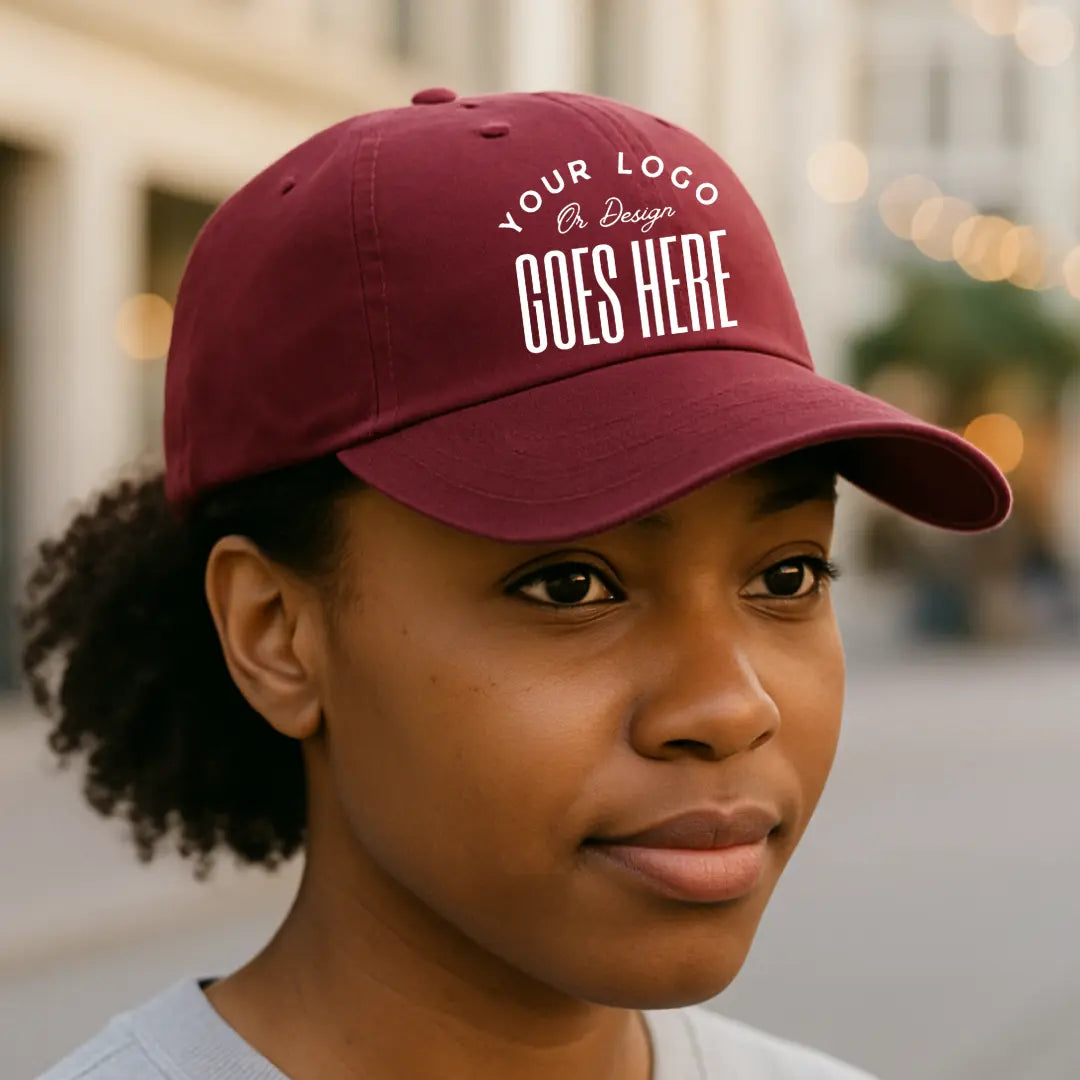 Custom twill hat by Winks Design Studio, LLC, shown in a beige color with a curved brim and adjustable strap.