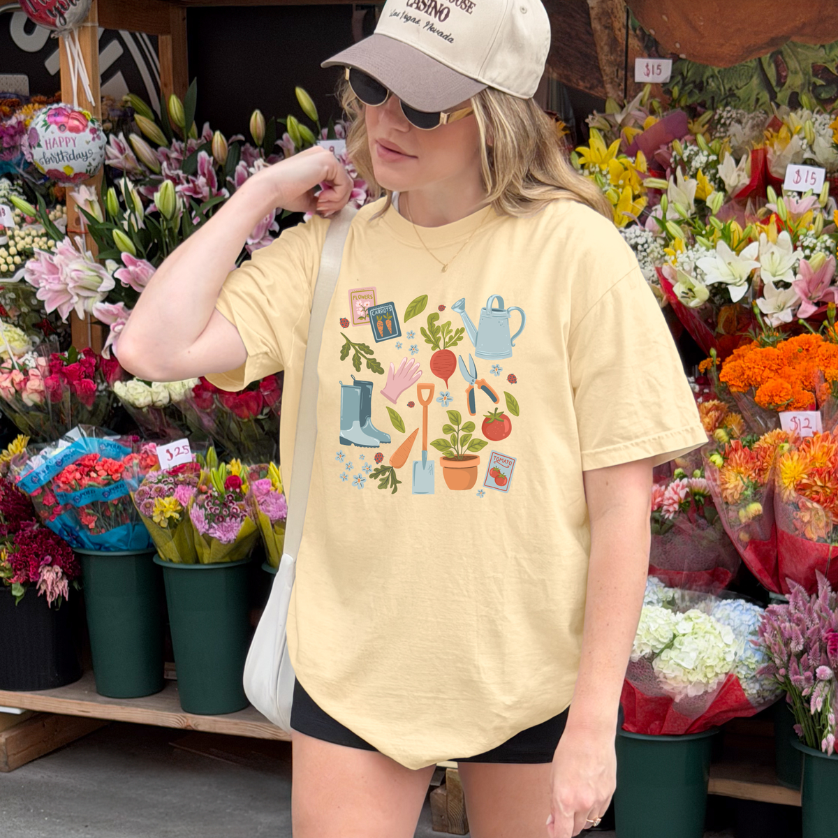Winks Design Studio Garden Essentials T-shirt, casual cotton top with garden-themed print, front view, vibrant colors, soft fabric.