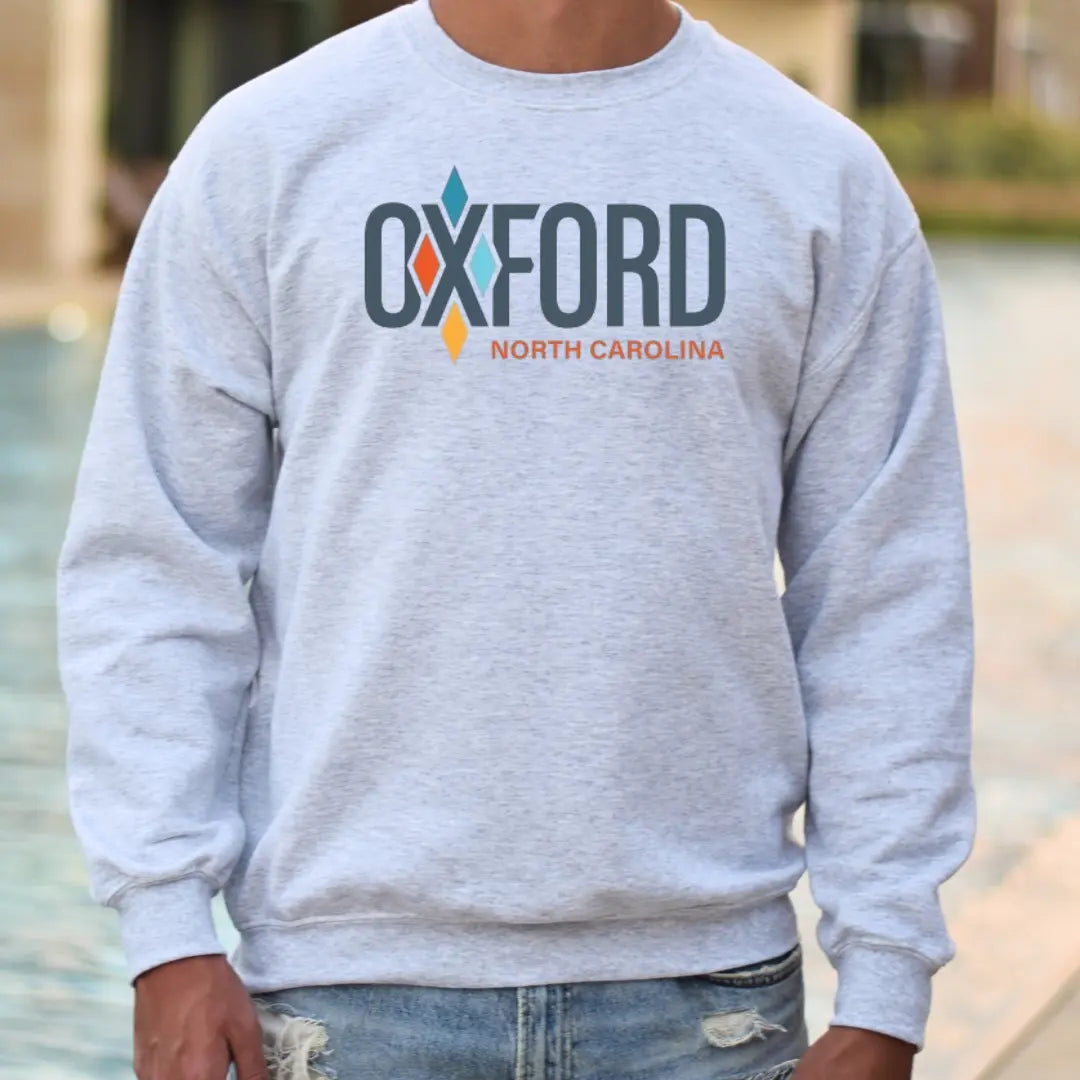 Winks Design Studio City of Oxford crewneck hoodie showing the front view with a printed cityscape design.