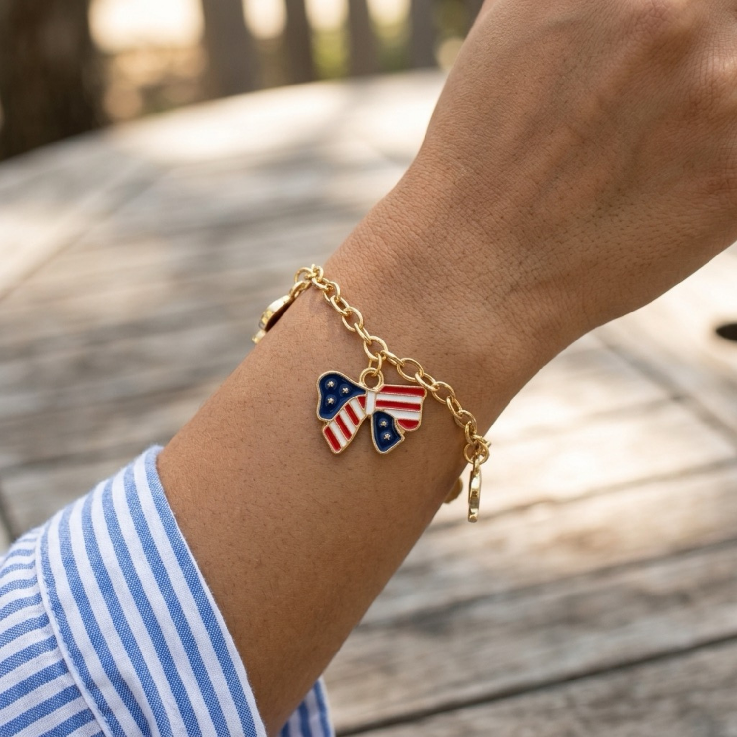 A women sitting at a bench showcasing her bracelet