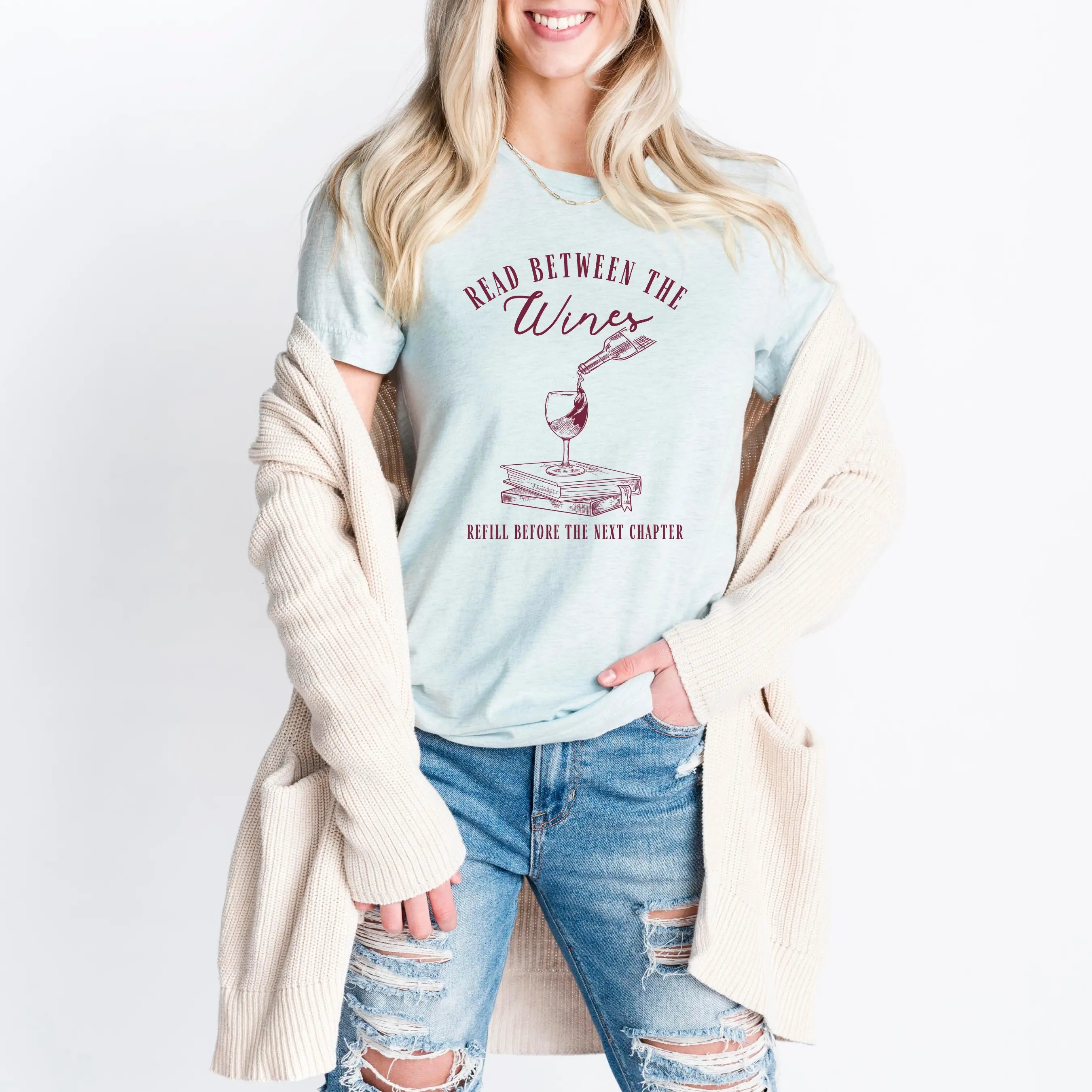 Read Between the Wines T-shirt by Winks Design Studio, LLC featuring a playful wine-themed graphic on a casual t-shirt.